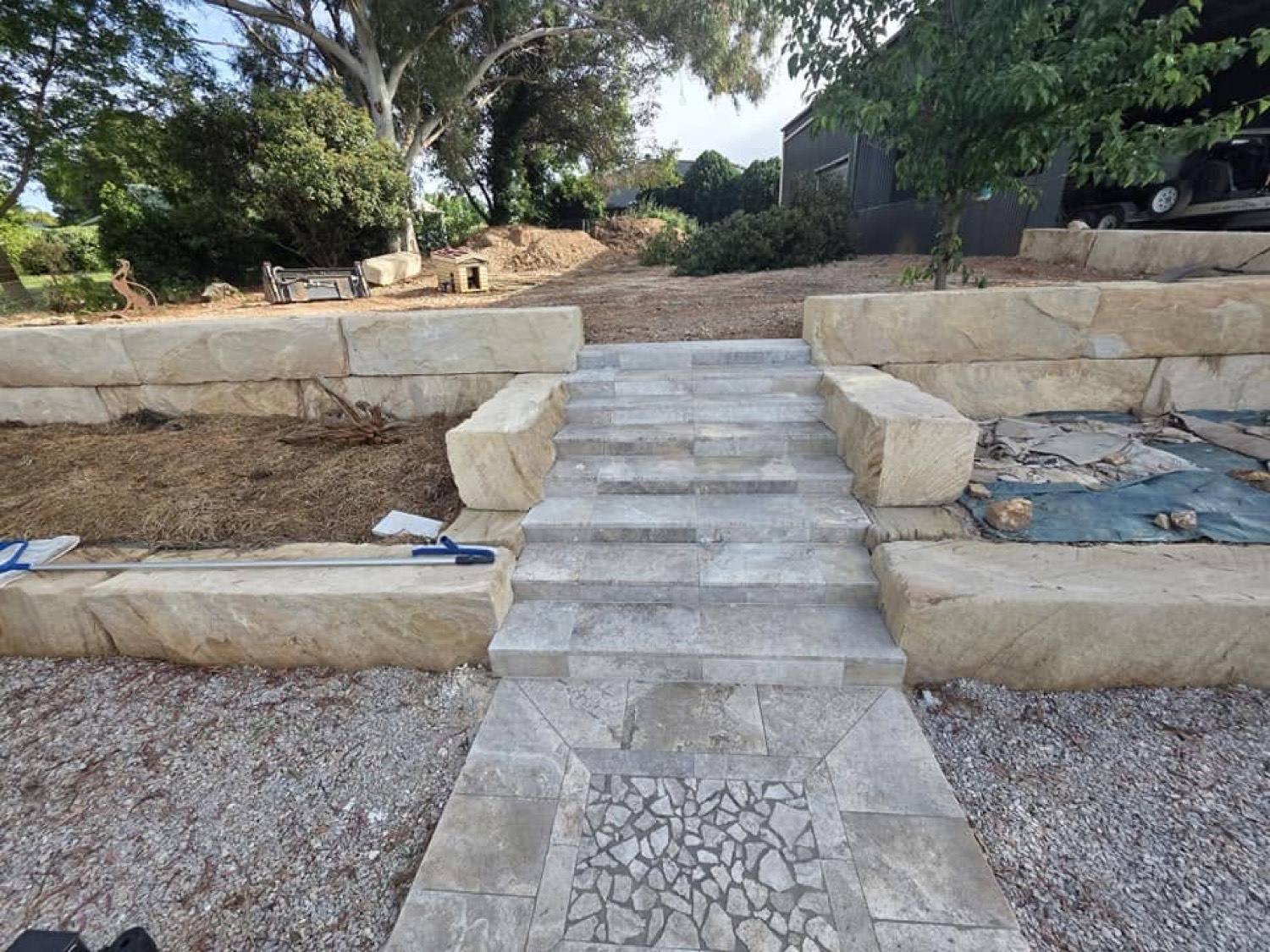 Sandstone blocks and stone treads forming a set of garden steps