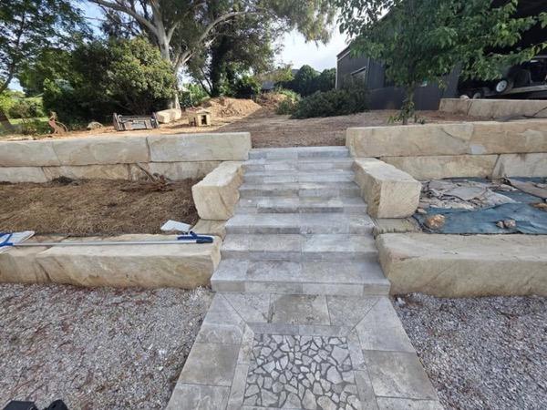 Sandstone blocks and stone treads forming a set of garden steps